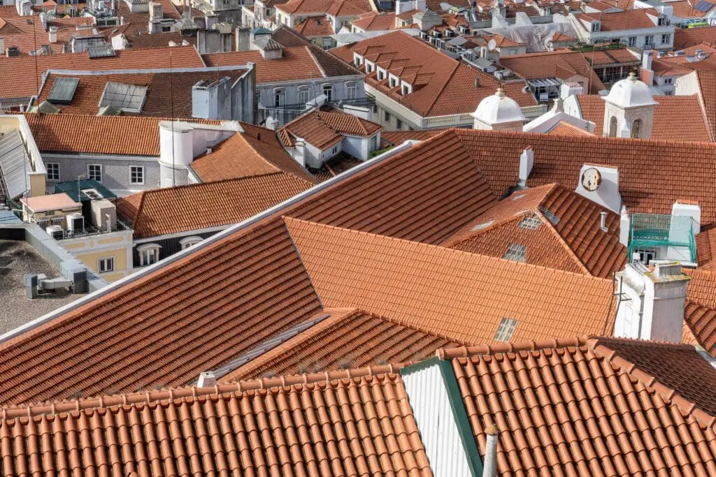 Aerial shot of houses with multiple roofs visible