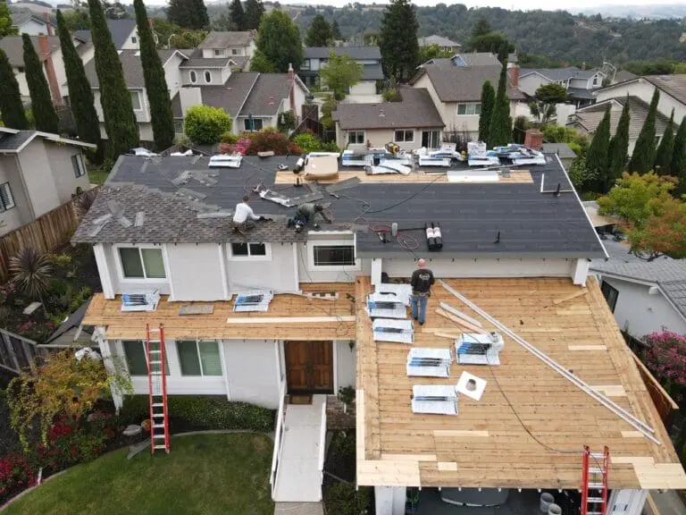 A group of men is conducting a reroofing job