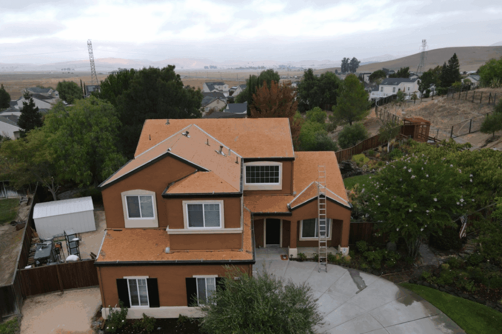 A big house with ladder beside on it