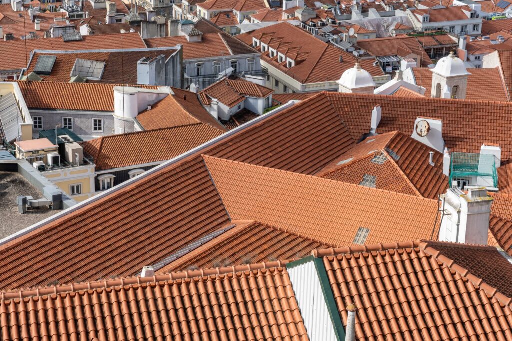 Aerial shot of houses with multiple roofs visible