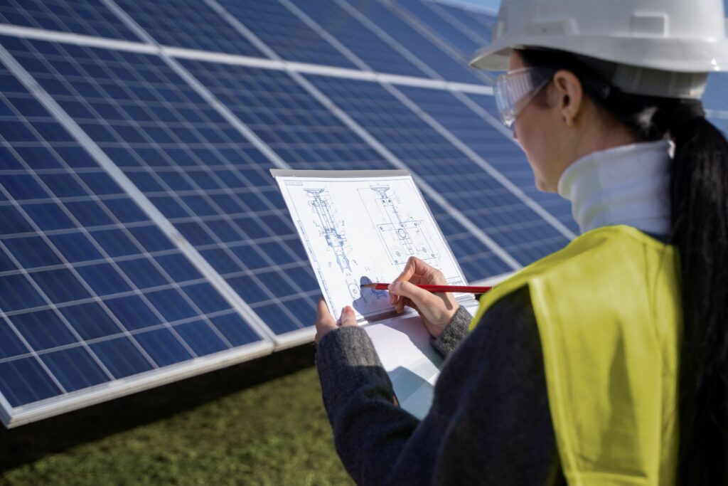 An engineer is drawing a sketch plan of the project