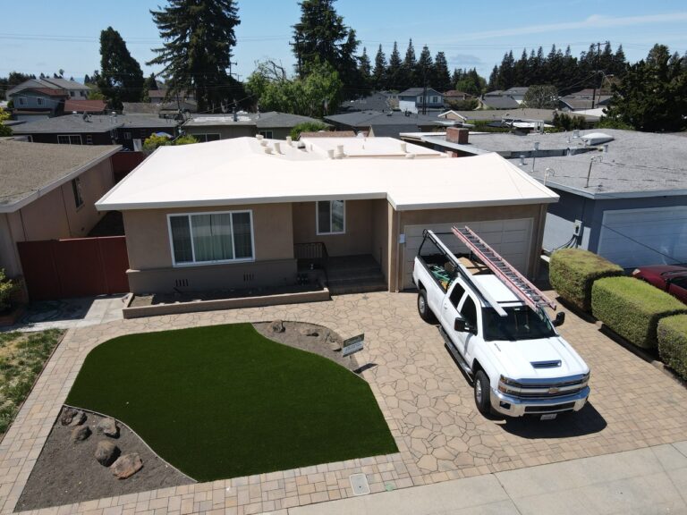 A pick up truck can be seen parking outside of a residential house