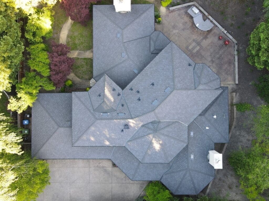 Aerial shot of a big house with massive roof