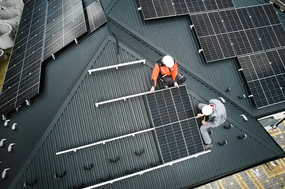 Roof workers are installed solar with solar support